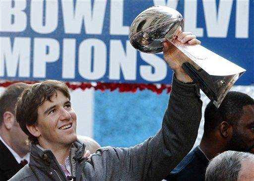 New York Giants - Super Bowl Football New York Giants wide receiver Victor  Cruz (80) holds the Vince Lombardi Trophy during the Super Bowl XLVl  football game against the New England Patriots